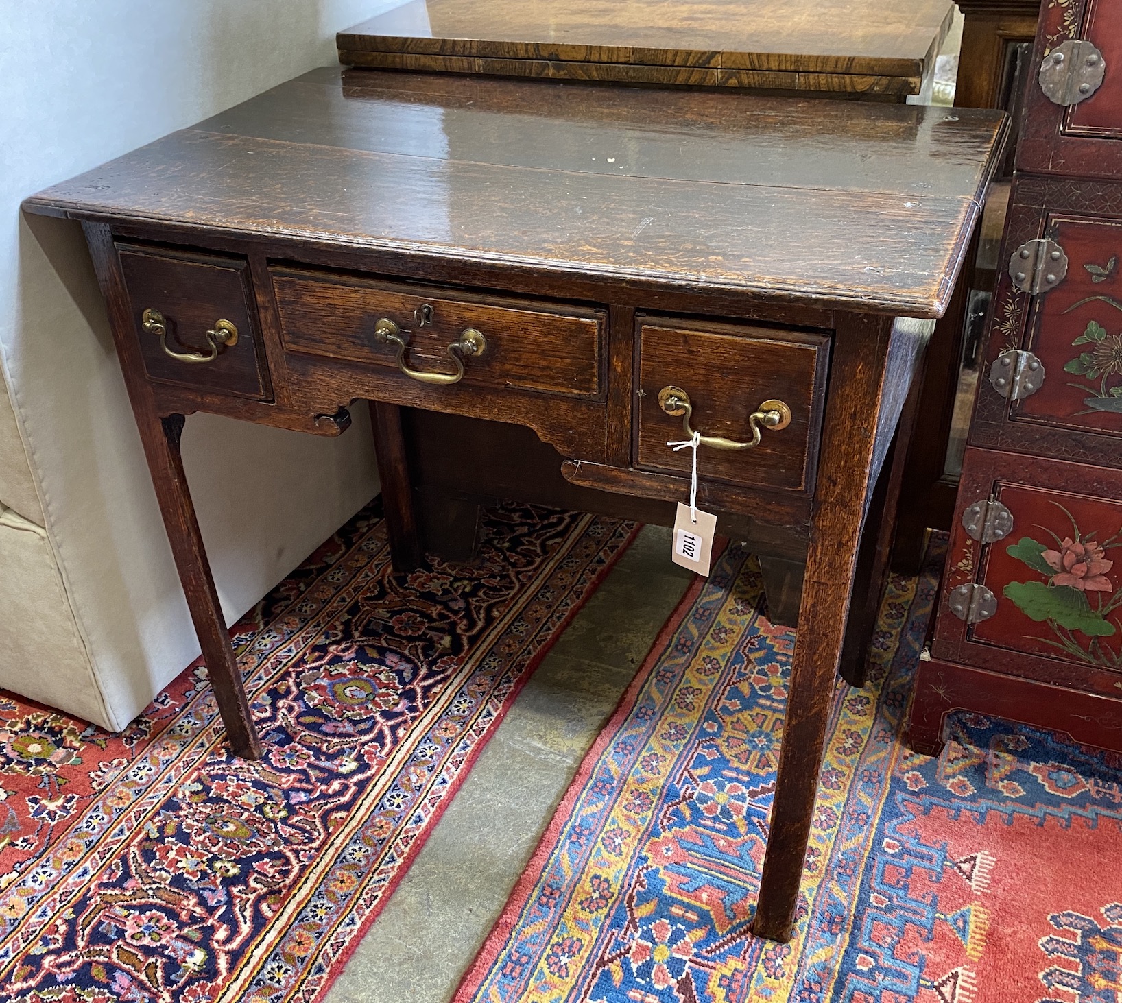 A George III oak lowboy, width 82cm, depth 51cm, height 73cm